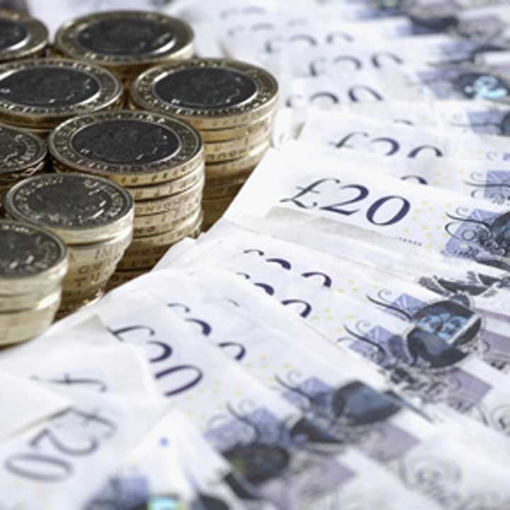 Stacks of One and Two Pound Coins, and Twenty Pound Notes