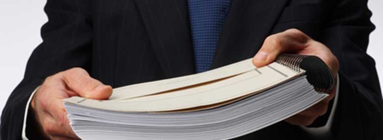 person holding a thick document