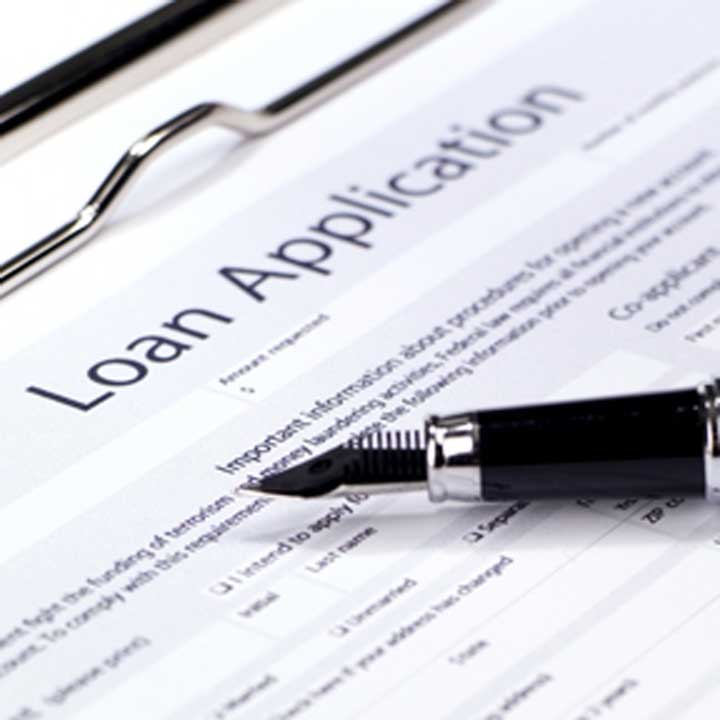 Loan application form with pen