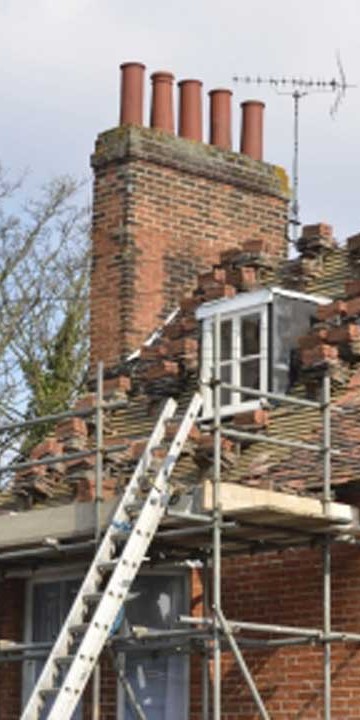 tiled roof being repaired