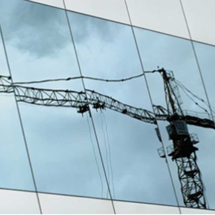 reflection of a crane on a window