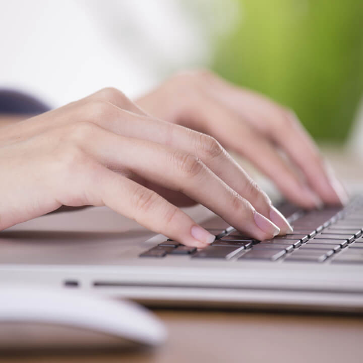 person typing on a keyboard