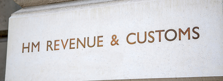 HM Revenue & Customs sign incised into the wall outside their headquarters in Whitehall, City of Westminster, London