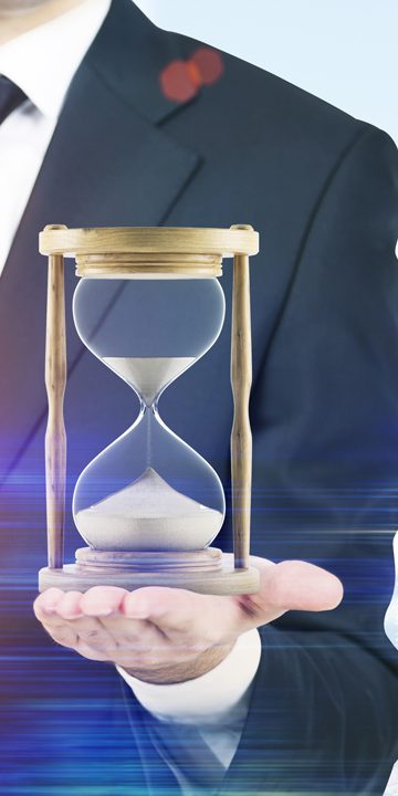 Close up of a businessman holding hourglass. Office. Cityscape. Concept of time management. Mock up. Toned image. Double exposure