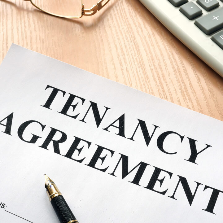 Tenancy agreement and keys from home in a real estate agency.