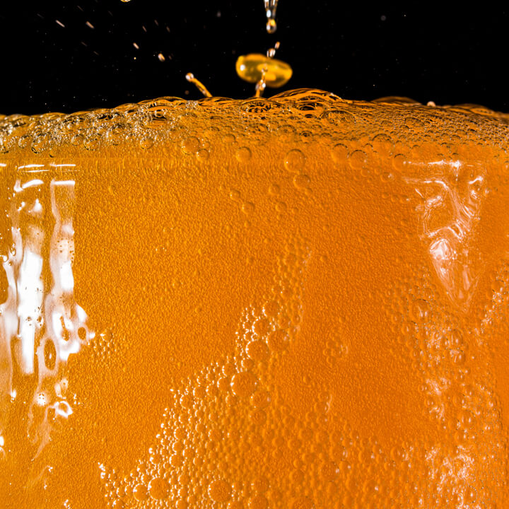 Fizzy orange drink in a glass