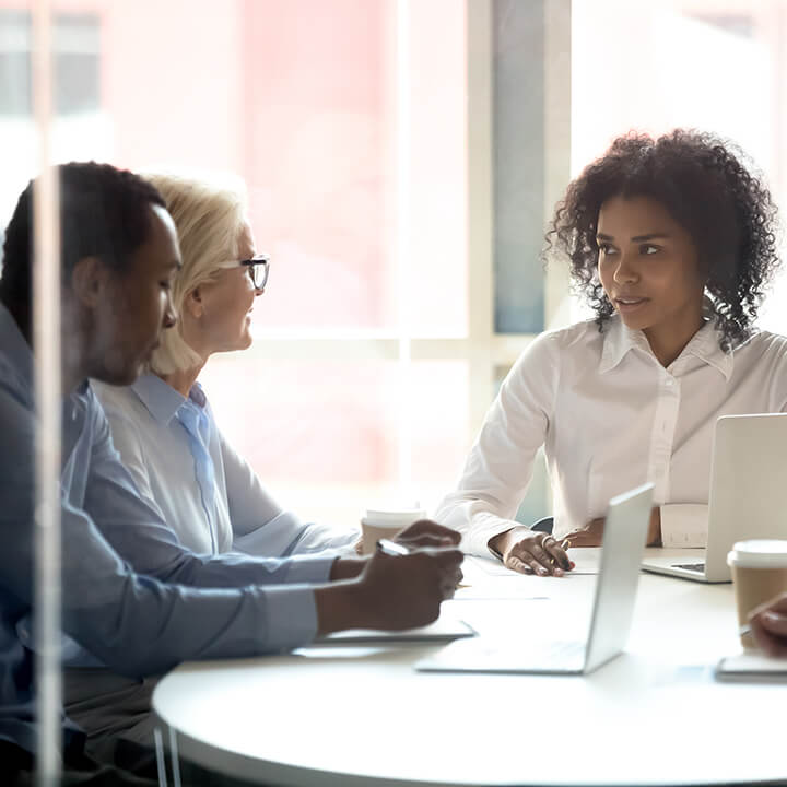 Corporate_lawyers_sat_around_table