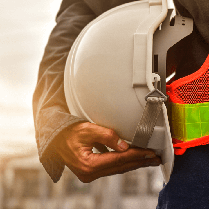 Construction & Engineering employee holding a hard hat