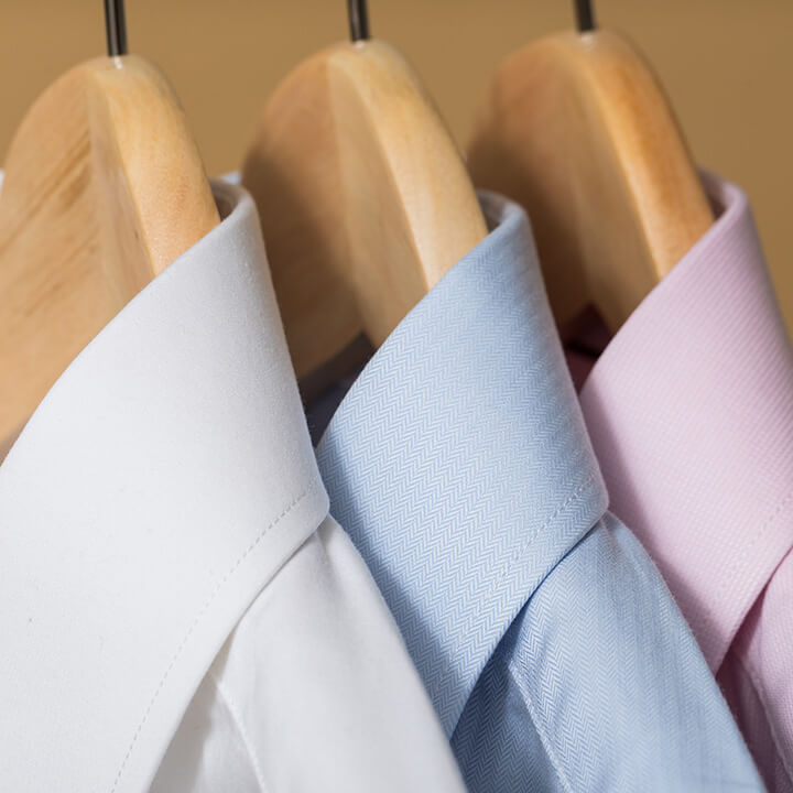 Work-shirts-on-wooden-hangers