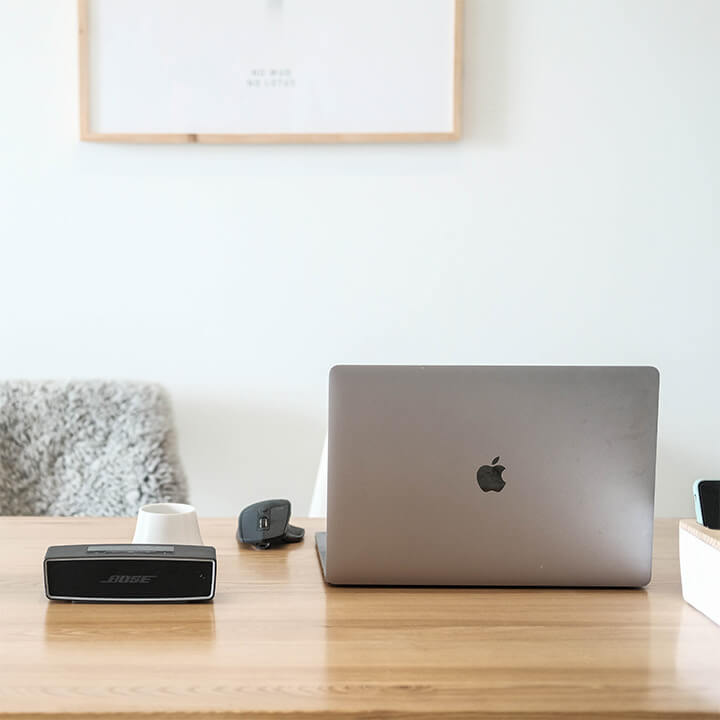 desk-with-apple-mac-and-speaker