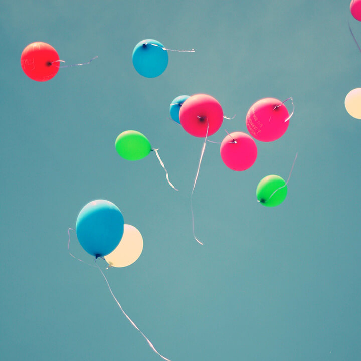 Multi-coloured-balloons floating in the sky to symbolise mental health awareness week