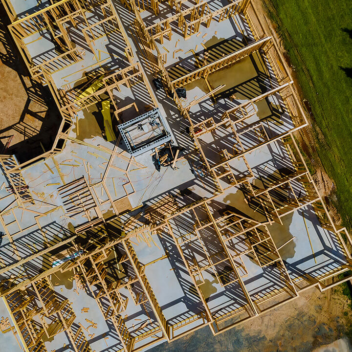An image of a home construction from above. A visual metaphor for this piece on restrictive covenants in land disputes.