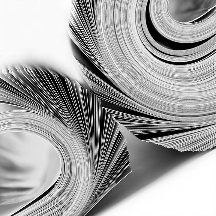 A close up image of two rolled magazines. A visual metaphor for changing documents, and the topic of this piece, a public procurement update