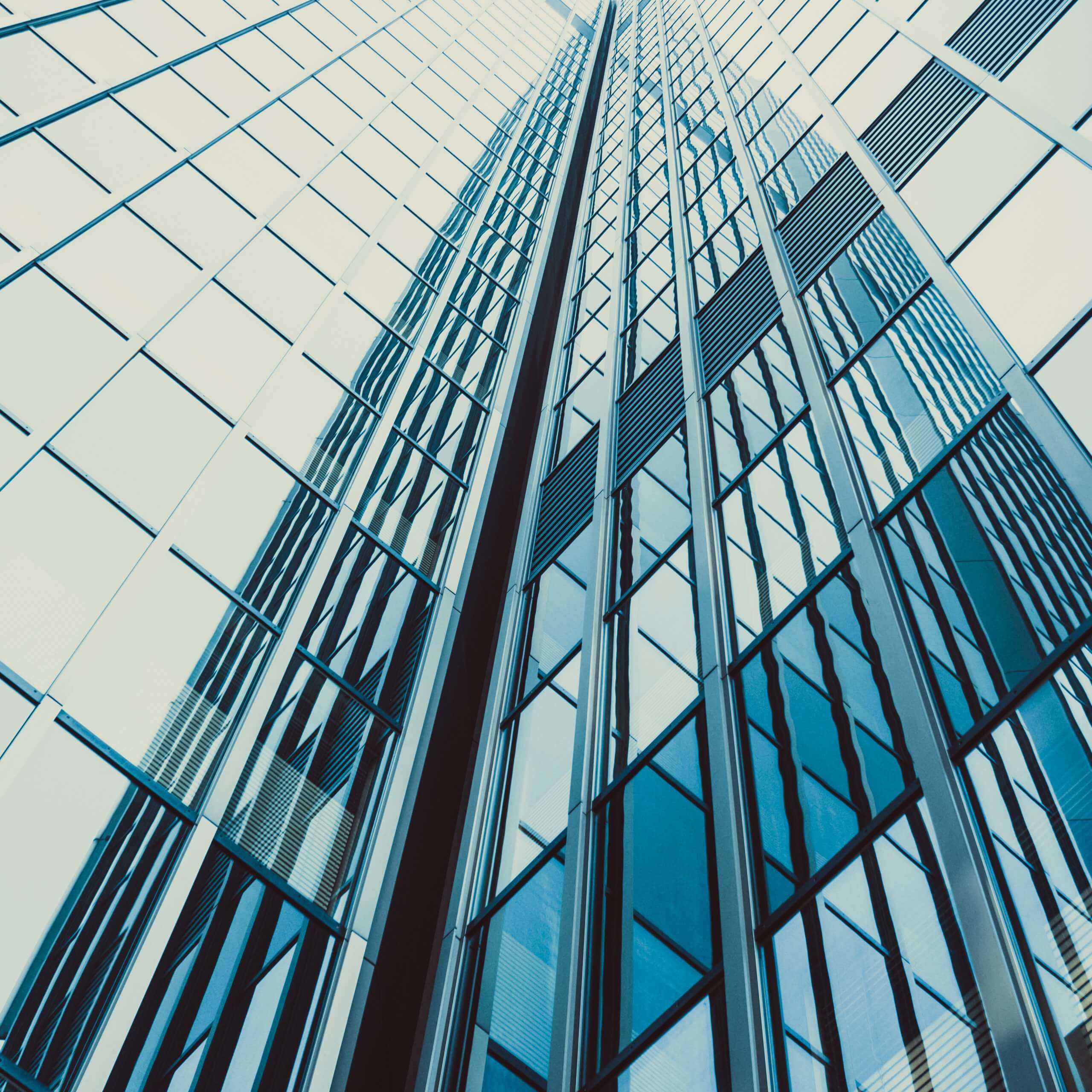 An abstract image of some office buildings. A visual metaphor for the topic of this series, Sponsorship requirements to work in the UK