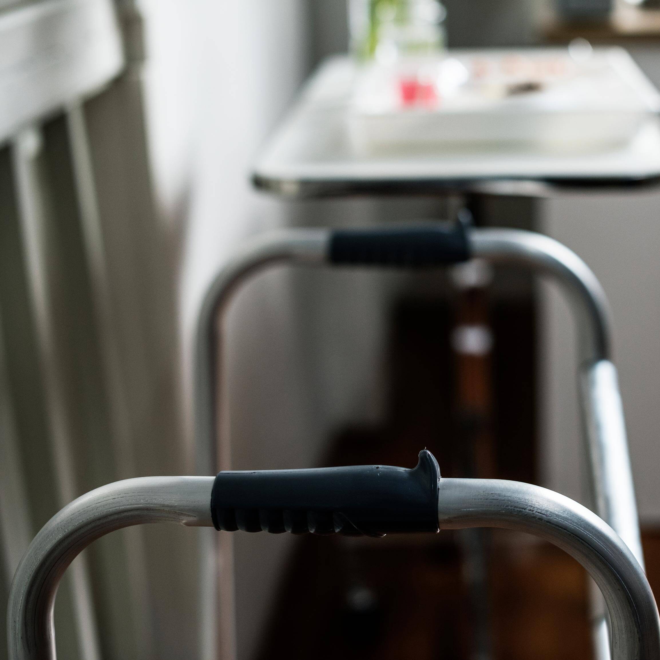 An image of close up detail of a walking frame. A visual metaphor for the topic of this post, The Carer's Leave Act 2023.